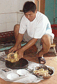 Uncle Preparing Chicken for the Table - Toisan