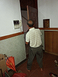Image: Baba shaving the front door - Click to Enlarge