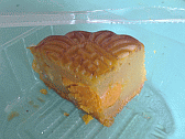 Image: A slice of Mooncake, note the yellow centre - Click to Enlarge