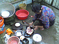 Image: Mama preparing the bird for cooking