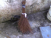 Image: To save wasting money, Mama made this brush out of twigs and sticky back plastic - Click to Enlarge