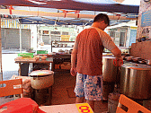 The local Sik Juk restaurant, the son checking on progress